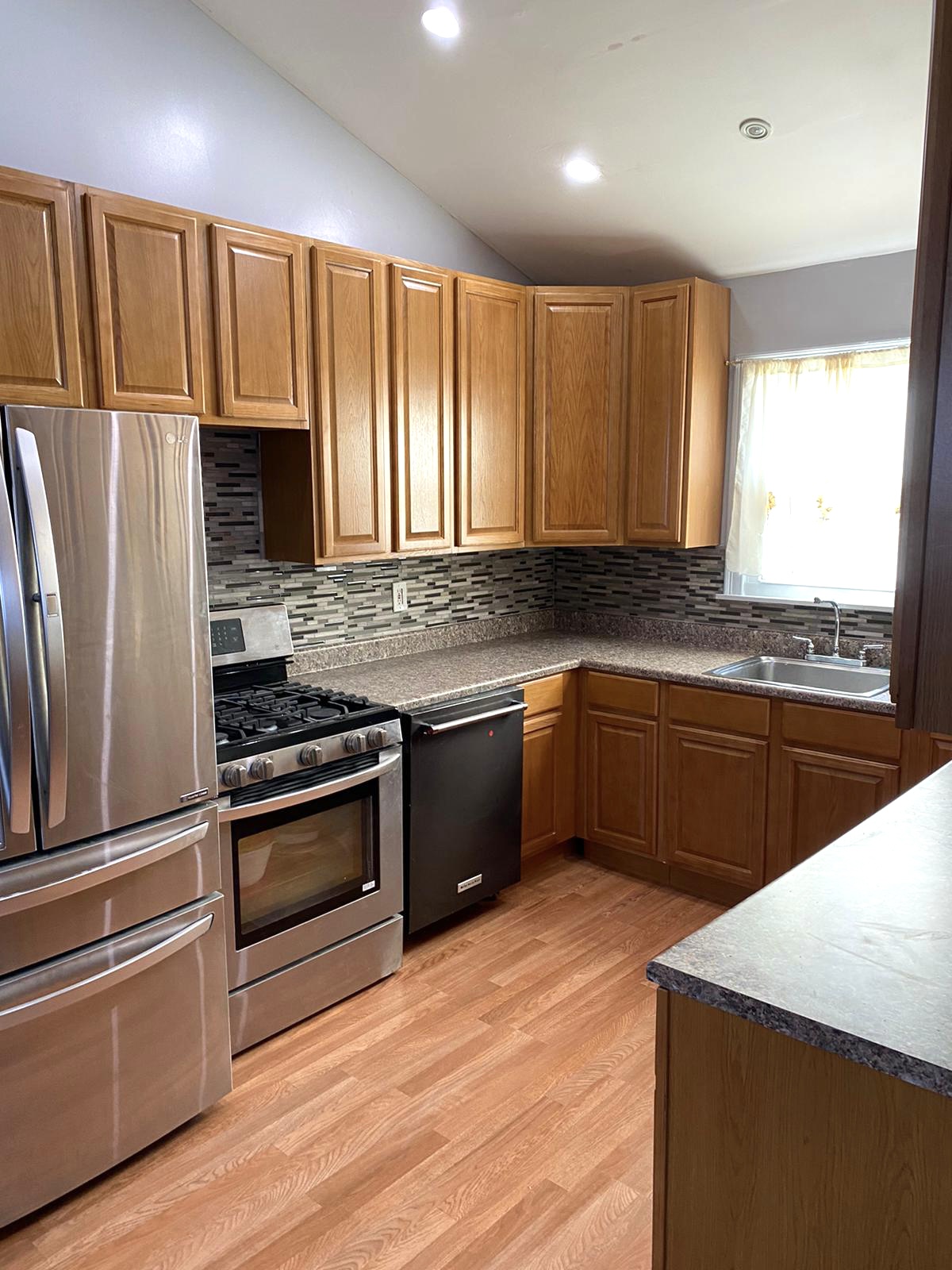 Kitchen remodel with full-height tile backsplash