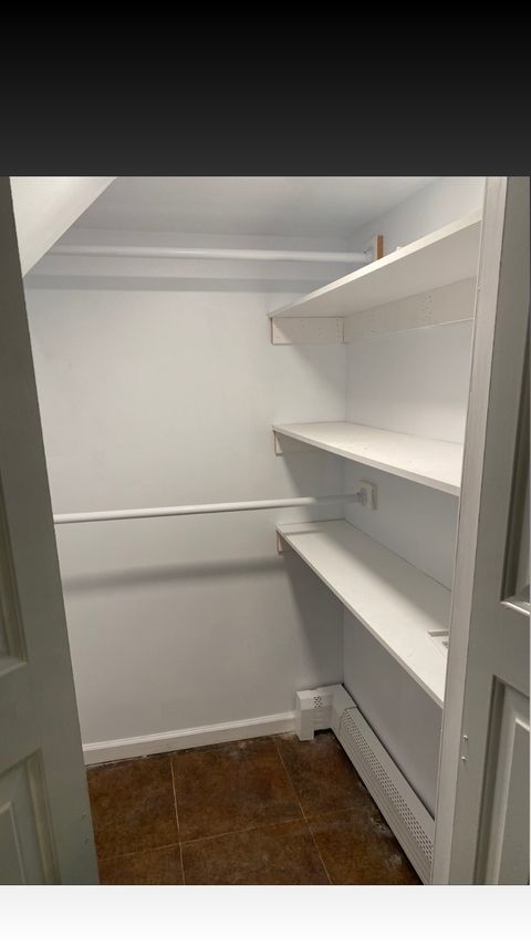 Custom closet with built-in dresser and shoe storage