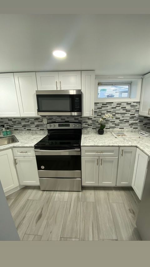 Kitchen remodel — open-concept layout with hardwood floors